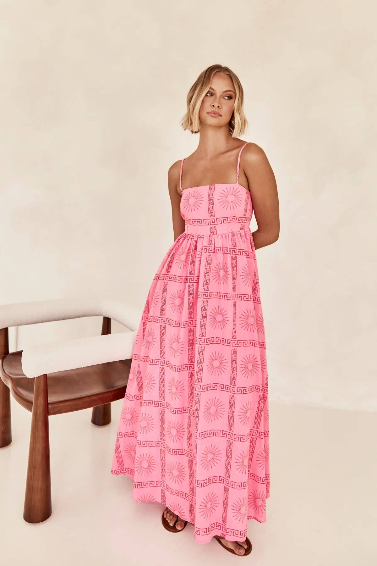 Printed and distinctive back-cut halter dress